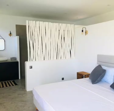 a bed with pillows and pillows on a bed