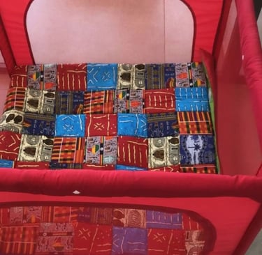 a baby's playpen with a red playpen