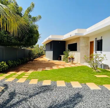 a house with a lawn and a small garden
