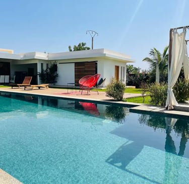 a pool with a red chair and a red chair