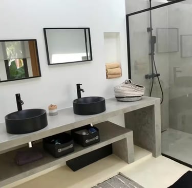 a patio with a couch and chairs and a television