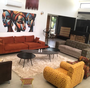 a living room with a couch and a painting