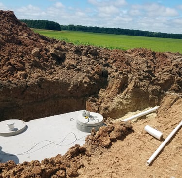 septic system in ground by dirt pile