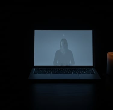 Empty desk at night with laptop still open