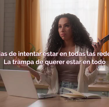a woman sitting at a table with a laptop and a remote control
