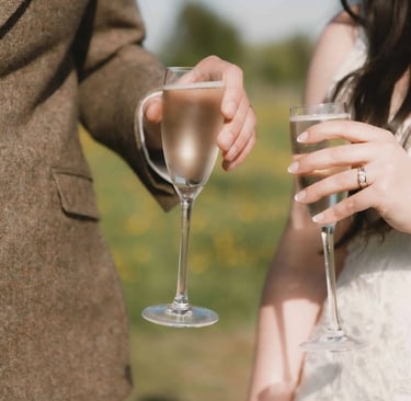 Bride and Groom share a glass of champagne