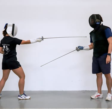 a woman having individual fencing lesson