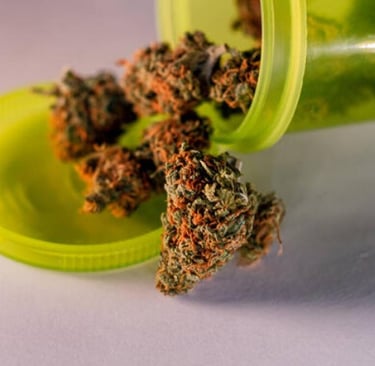 a green bottle of marijuana marijuana in a green container