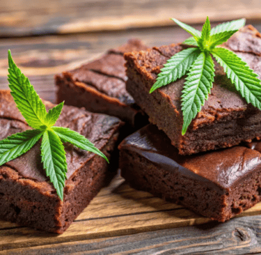 March’s Must-Try Cannabis Edibles -a stack of brownies with marijuana leaf on top