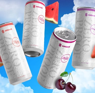 a group of three cans of soda cans with fruit on them