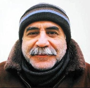 Kuddusi Okkır Kimdir