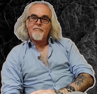 a man with a beard and glasses on a table