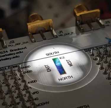 Packaged circuit board containing the chip placed under microscope in probestation during an experim