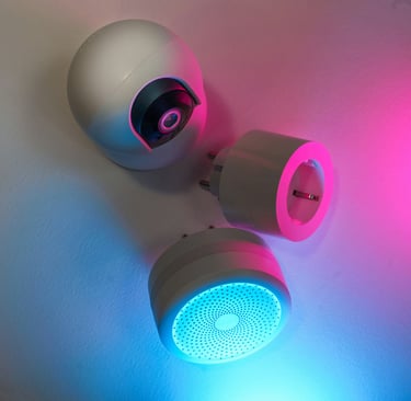 Wall-mounted smart speaker and CCTV with pink-cyan lighting