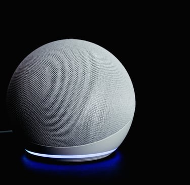 Futuristic white smart speaker with glowing lights in dark background