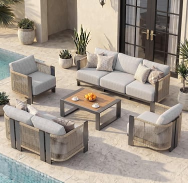Modern outdoor sectional sofa set with grey cushions and rope detailing on a luxury poolside patio.