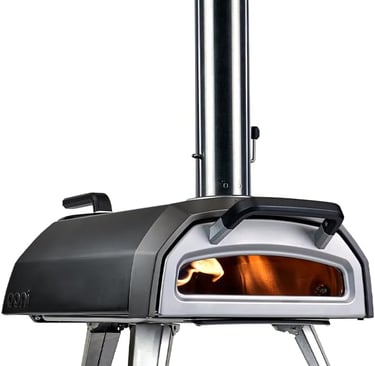 A portable outdoor wood-fired pizza oven with a stainless steel chimney and a glowing flame inside.