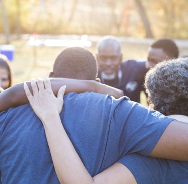 a group of PACE family members standing in a circle