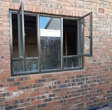 Bronze casement window installation in Bluff