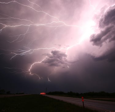 lightning strike high in the storm clouds