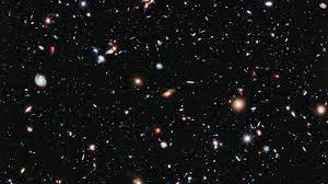 an image of the universe featuring thousands of galaxies