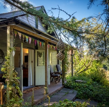 a house with a porch and a wooden deck