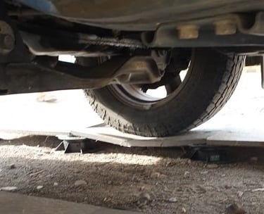 a car that is sitting on a broken tile that has been treated with SafePave