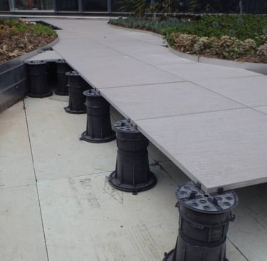 Tiles on adjustable pedestals