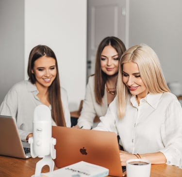 women using a laptop computer to contact medaesthetics laser and wellness