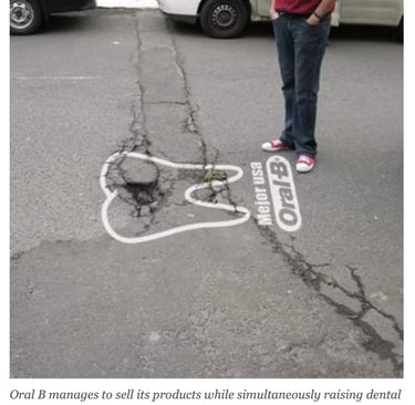 Oral-B guerrilla marketing campaign in Quito Ecuador using a street crack shaped as a decayed tooth