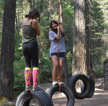 two women standing on a tire - less tire - less tire - less tire -