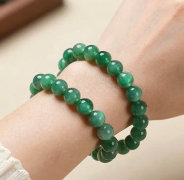 A selection of colorful gemstones laid out on a wooden table.