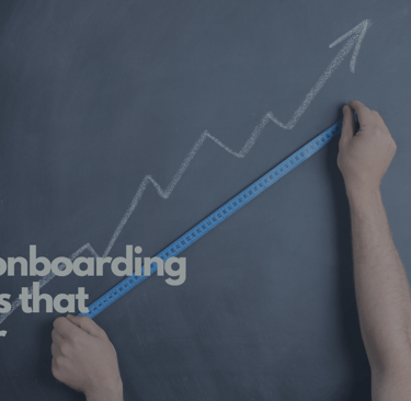 A chalkboard with an arrow pointing up and a caption of customer onboarding metrics that matter.