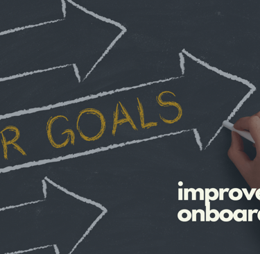 A chalkboard with arrows and the caption of improve B2B customer onboarding.
