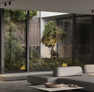 3D rendering of a modern indoor space with grey sectional sofa, low coffee table, glass panels, greenery, and natural light