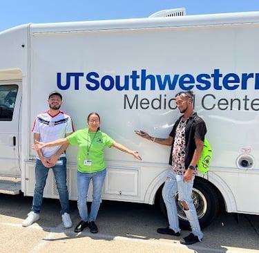 ut southwest project impact group standing in front of a white van at fly ink