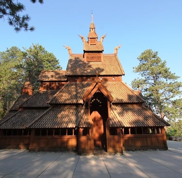 a wooden structure with a wooden roof and a wooden door