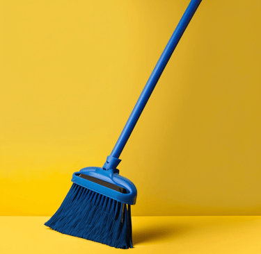 a broom with a yellow background