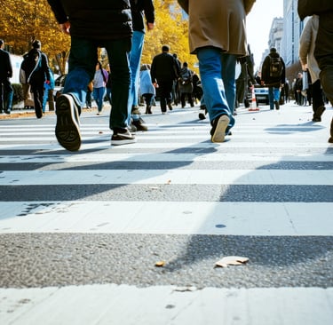Urban crowd crossing street, symbolizing emergency preparedness and survival planning in busy cities