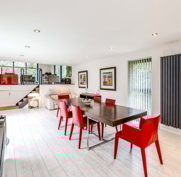 a dining room with a table and chairs