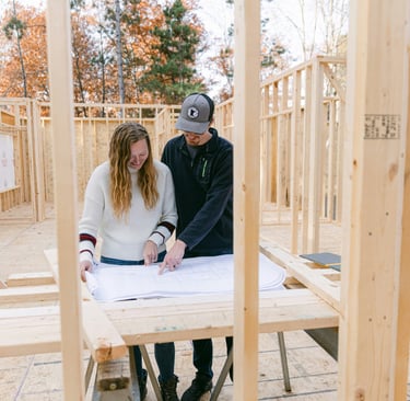 couple looking over construction plans