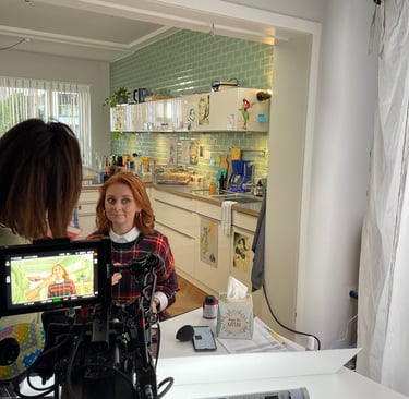 a woman is filming a video camera and a video camera
