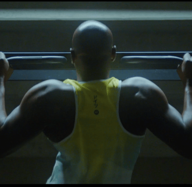 black man doing pull-ups