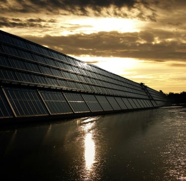 Black Solar Panel Near Calm Body of Water