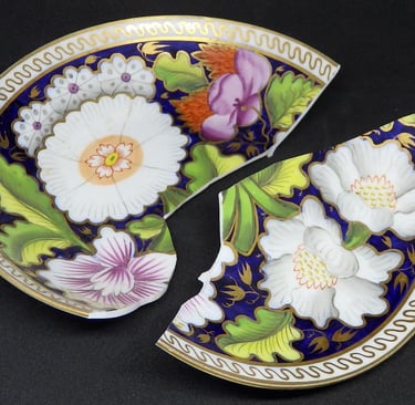 Broken New Hall floral saucer before conservation