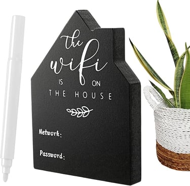 a house with a plant in a potted planter