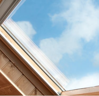 windows of roof with a skylight in the middle of a wooden ceiling
