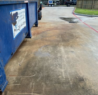 Dumpster Stains in Parking Lot