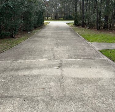 Driveway before pressure washing