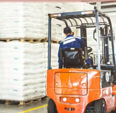 a forklift truck with a forklift truck in the background